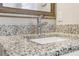 Close-up of a bathroom sink with granite countertop and faucet at 409 Katherine Ln, Woodstock, GA 30189