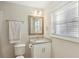 Clean bathroom with granite countertop and a white vanity at 409 Katherine Ln, Woodstock, GA 30189