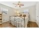 Spacious bedroom with hardwood floors and a ceiling fan at 409 Katherine Ln, Woodstock, GA 30189