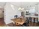 Bright dining area with hardwood floors and a rustic wooden table at 409 Katherine Ln, Woodstock, GA 30189