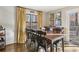 Bright dining area with wooden table and deck access at 409 Katherine Ln, Woodstock, GA 30189