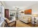 Cozy living room with hardwood floors and a view into the kitchen at 409 Katherine Ln, Woodstock, GA 30189