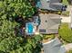 Aerial view of house with pool and lush trees at 436 Suwanee East Dr, Lawrenceville, GA 30043