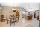 Bright dining area with a glass-top table and hardwood floors at 436 Suwanee East Dr, Lawrenceville, GA 30043