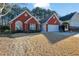 Red brick home with a well-maintained lawn at 436 Suwanee East Dr, Lawrenceville, GA 30043