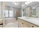 Elegant bathroom with double vanity and soaking tub at 9032 Selborne Ln, Chattahoochee Hills, GA 30268