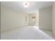 Bright, spacious bedroom features plush carpeting and a private balcony door, and natural light at 9032 Selborne Ln, Chattahoochee Hills, GA 30268