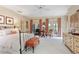 Bright bedroom featuring French doors opening to the outdoors at 9032 Selborne Ln, Chattahoochee Hills, GA 30268