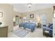 Serene bedroom with twin beds and private balcony access at 9032 Selborne Ln, Chattahoochee Hills, GA 30268