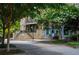 Quaint street with shops and lush trees at 9032 Selborne Ln, Chattahoochee Hills, GA 30268