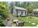 Charming garden with stone pathway and detached studio at 9032 Selborne Ln, Chattahoochee Hills, GA 30268