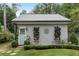 Gray guest house with light blue door and landscaping at 9032 Selborne Ln, Chattahoochee Hills, GA 30268