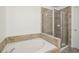 Bathroom with a large soaking tub and shower at 3136 Mercer University Dr # 6, Chamblee, GA 30341