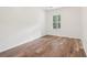 Well-lit bedroom featuring hardwood floors and a window at 3136 Mercer University Dr # 6, Chamblee, GA 30341