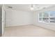 Bright bedroom featuring a large window and ceiling fan at 3136 Mercer University Dr # 6, Chamblee, GA 30341