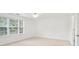 Bright bedroom with neutral walls and carpet at 3136 Mercer University Dr # 6, Chamblee, GA 30341