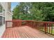 Wooden deck overlooking backyard with lush trees at 3136 Mercer University Dr # 6, Chamblee, GA 30341