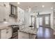 Open kitchen with stainless steel appliances and granite island at 4743 Roswell Rd, Atlanta, GA 30342