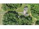 Aerial view showing house, guest house, and surrounding woods at 900 Cass Pine Log Rd, Rydal, GA 30171