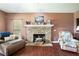 Living room with stone fireplace and hardwood floors at 900 Cass Pine Log Rd, Rydal, GA 30171