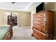 Main bedroom with large dresser and view into home office at 900 Cass Pine Log Rd, Rydal, GA 30171