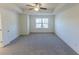 Bright and airy bedroom with carpeted floor and ceiling fan at 1884 Plainsboro Dr, Lithonia, GA 30058