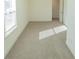 Spacious bedroom with carpeted floor and large window at 1884 Plainsboro Dr, Lithonia, GA 30058