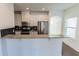 Modern kitchen with granite countertops and stainless steel appliances at 1884 Plainsboro Dr, Lithonia, GA 30058