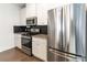 Modern kitchen with granite countertops and stainless steel appliances at 1884 Plainsboro Dr, Lithonia, GA 30058