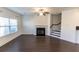 Spacious living room featuring a fireplace and hardwood floors at 1884 Plainsboro Dr, Lithonia, GA 30058