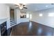 Spacious living room with hardwood floors, fireplace and stairs to upper level at 1884 Plainsboro Dr, Lithonia, GA 30058