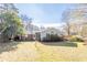 Large backyard with grassy area and mature trees at 2384 Bradcliff Ne Dr, Atlanta, GA 30345