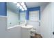 Clean bathroom with blue walls, white vanity, and updated fixtures at 2384 Bradcliff Ne Dr, Atlanta, GA 30345