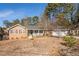 Brick ranch home with covered porch and mature trees at 2384 Bradcliff Ne Dr, Atlanta, GA 30345