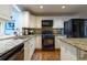 Modern kitchen with granite countertops and black appliances at 2384 Bradcliff Ne Dr, Atlanta, GA 30345