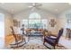 Sunlit living room with hardwood floors, comfortable seating and large windows at 2384 Bradcliff Ne Dr, Atlanta, GA 30345