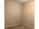 Bedroom with patterned accent wall at 252 Magnaview Dr, Mcdonough, GA 30253