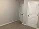 Empty bedroom with two doors and carpet flooring at 252 Magnaview Dr, Mcdonough, GA 30253