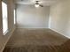 Spacious living room with carpeted floor and large windows at 252 Magnaview Dr, Mcdonough, GA 30253