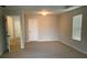 Spacious main bedroom with a window and carpet at 252 Magnaview Dr, Mcdonough, GA 30253