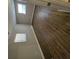 Simple bedroom with wood-look floors and neutral walls at 258 Pickett Bridge Rd, Covington, GA 30016