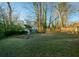 Large backyard with mature trees and shed at 679 Montevista St, Atlanta, GA 30310