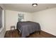 Simple bedroom with a double bed, wood floors, and white walls at 679 Montevista St, Atlanta, GA 30310