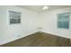 Bright bedroom with hardwood floors and two windows at 679 Montevista St, Atlanta, GA 30310