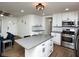 Modern kitchen with stainless steel appliances and a large kitchen island at 679 Montevista St, Atlanta, GA 30310