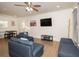 Bright living room features hardwood floors, comfy sectional sofa, and a large TV at 679 Montevista St, Atlanta, GA 30310