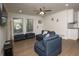 Open concept living room with hardwood floors and a ceiling fan at 679 Montevista St, Atlanta, GA 30310