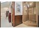 Elegant bathroom with a large walk-in shower and dark wood vanity at 824 Amsterdam Ne Ave, Atlanta, GA 30306