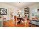 Formal dining room features round table, hardwood floors and built-in shelving at 824 Amsterdam Ne Ave, Atlanta, GA 30306