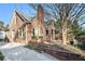 Side view of brick home showcasing driveway and landscaping at 824 Amsterdam Ne Ave, Atlanta, GA 30306